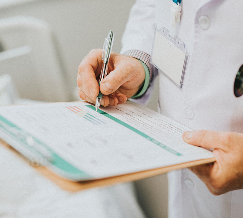 Physician Noting Down Symptoms Patient1